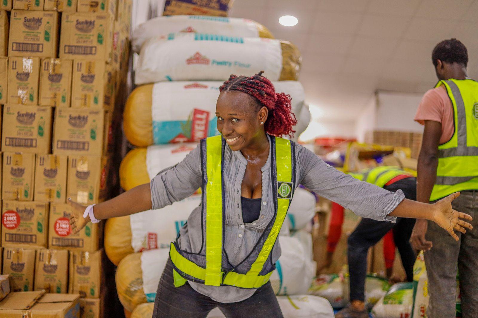 Warehouse staff among stacked goods